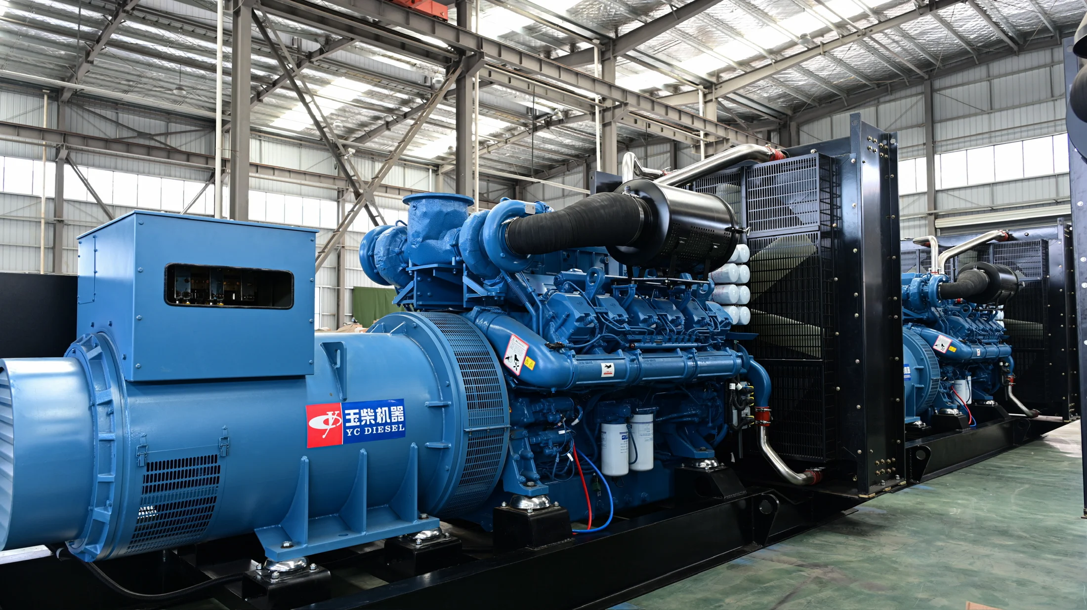 Blue industrial diesel generator set with engine, alternator and radiator